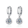Bee-Bee's silver hoop earrings with dangling round moissanite pendants. D Color VVS1 stones.