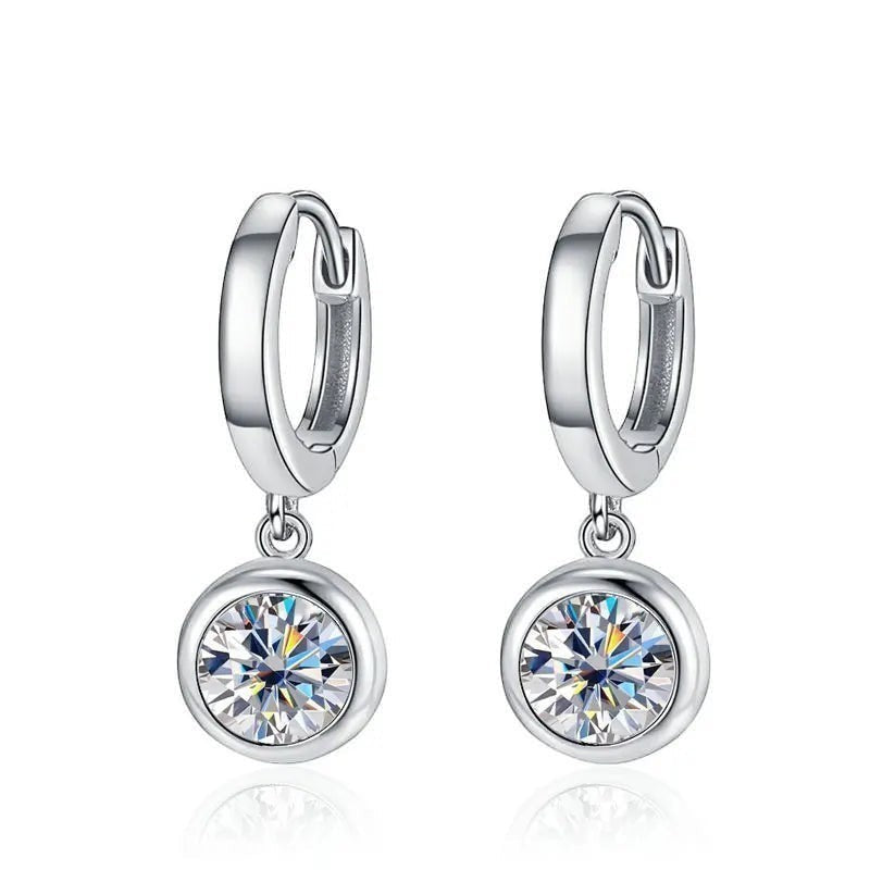 Bee-Bee's silver hoop earrings with dangling round moissanite pendants. D Color VVS1 stones.