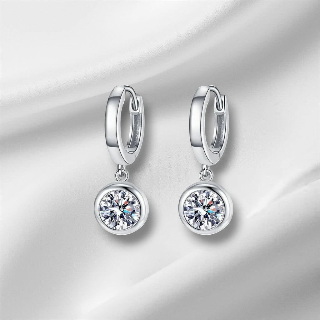 Bee-Bee's sterling silver hoop earrings with D color VVS1 moissanite drop pendants. Hypoallergenic, GRA certified.