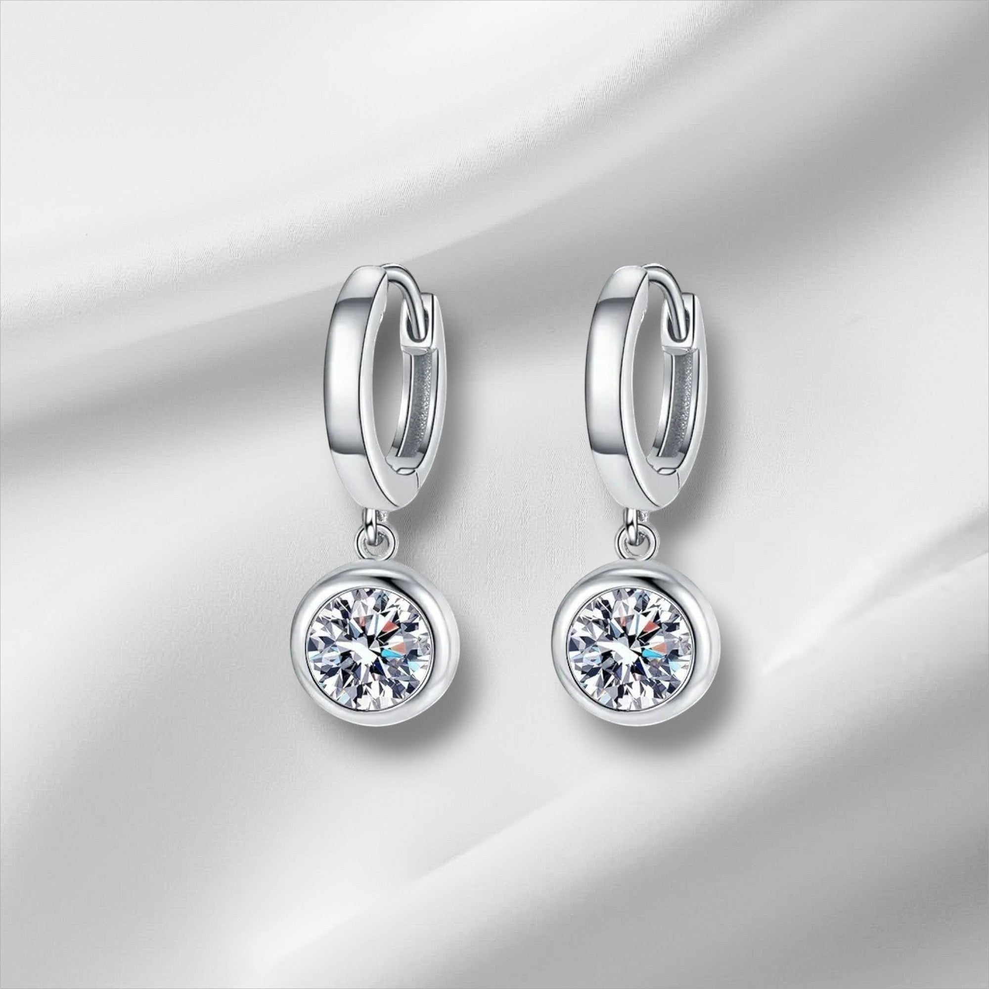 Bee-Bee's sterling silver hoop earrings with D color VVS1 moissanite drop pendants. Hypoallergenic, GRA certified.