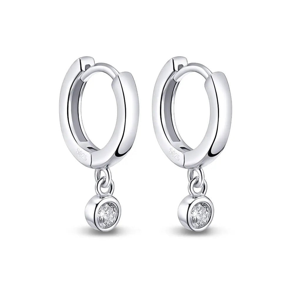 Bee-Bee's sterling silver hoop earrings with dangling moissanite pendants. D color VVS1 stones.
