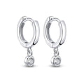 Bee-Bee's sterling silver hoop earrings with dangling moissanite pendants. D color VVS1 stones.