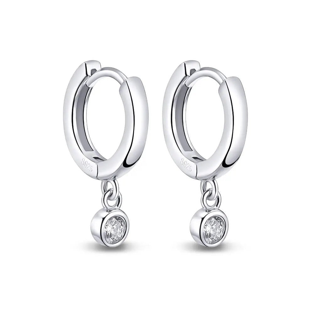 Bee-Bee's sterling silver hoop earrings with dangling moissanite pendants. D color VVS1 stones.