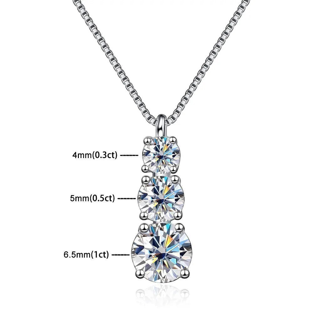 Bee-Bees sterling silver necklace with three round brilliant cut moissanite pendants in graduating sizes: 4mm, 5mm, and 6.5mm.