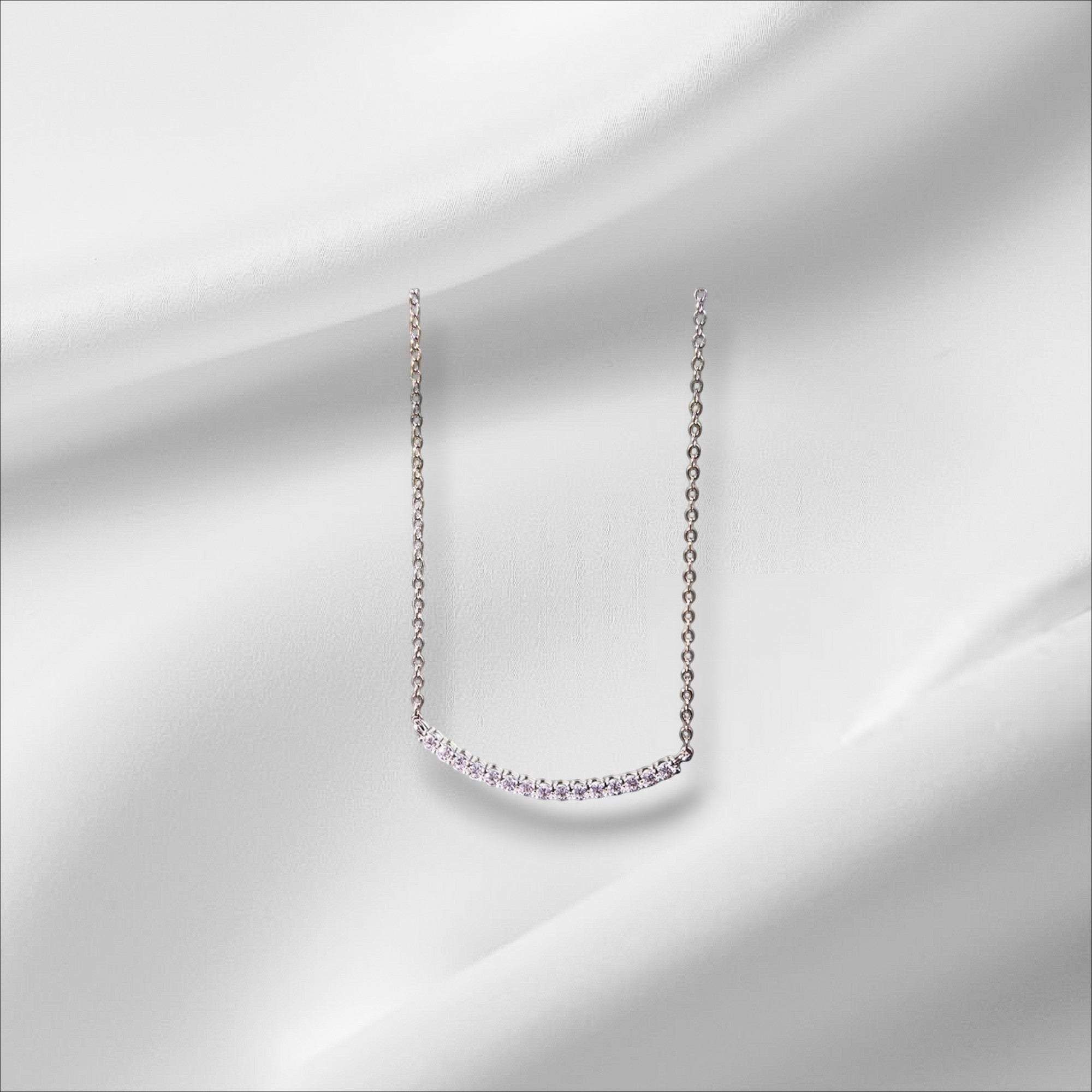 Bee-Bees D VVS1 Moissanite smile pendant necklace in 18k gold plated sterling silver with a curved row of sparkling stones.