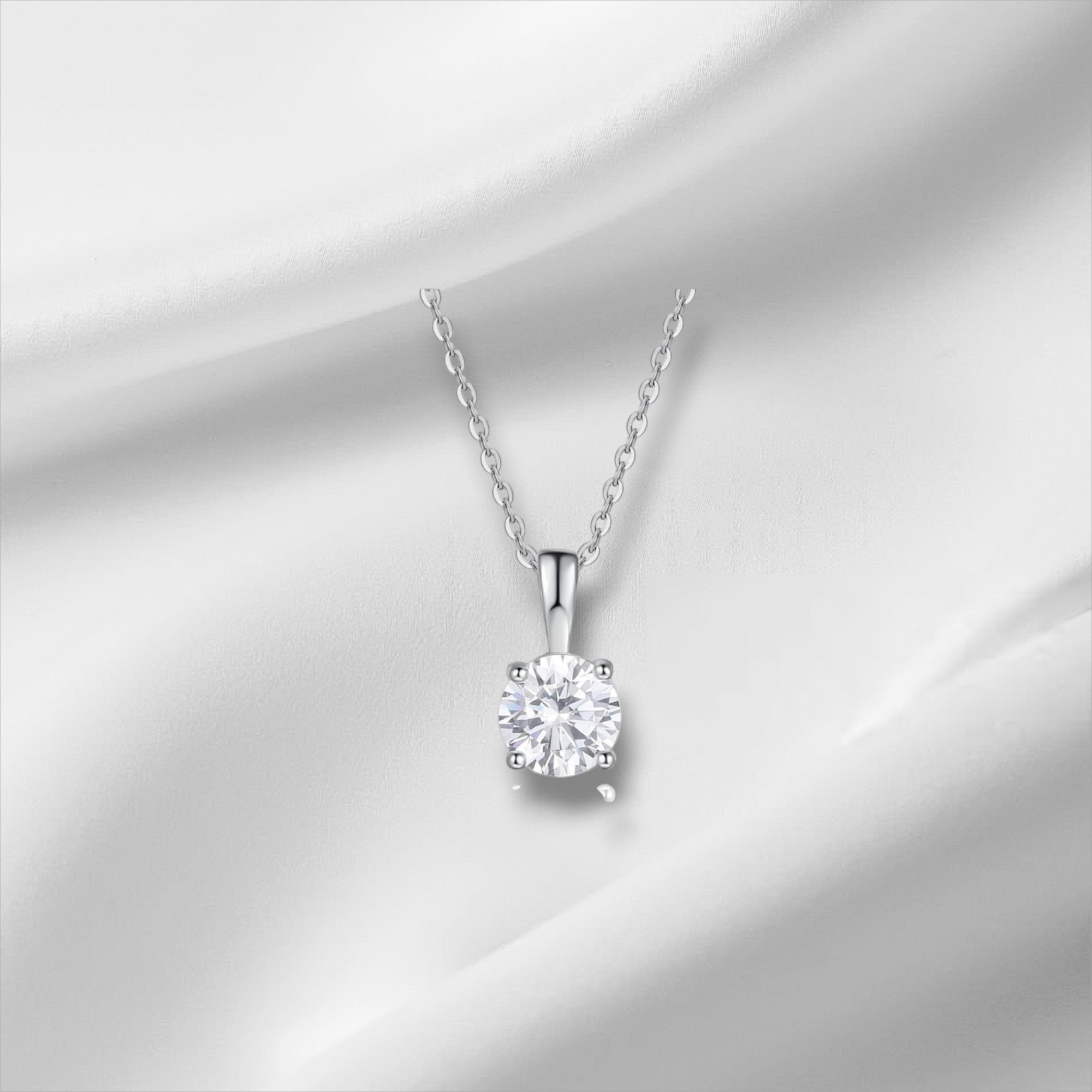 Bee-Bee's 1ct D VVS1 Moissanite solitaire necklace in 18k gold plated sterling silver with a round-cut stone on an adjustable chain.
