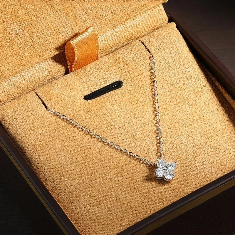 Bee-Bee's 0.4ct Moissanite solitaire pendant necklace in S925 silver with gold plating, featuring a flower design with clear stones.