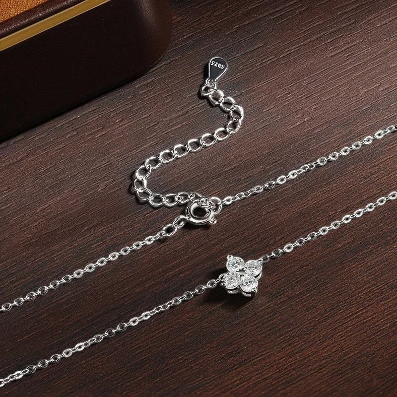 Bee-Bee's 0.4ct Moissanite solitaire pendant necklace in S925 silver with gold plating, featuring a delicate flower design with clear stones.
