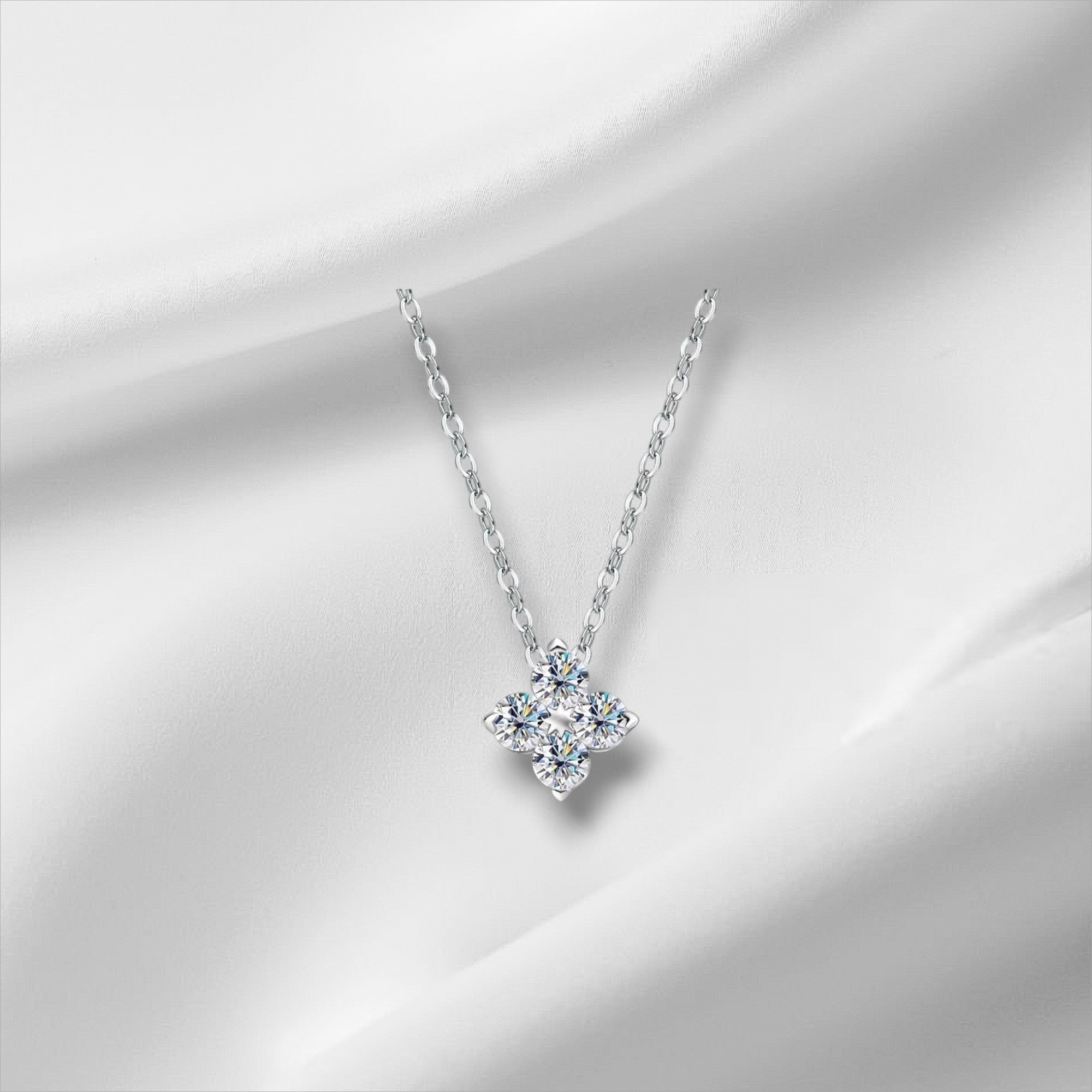 Bee-Bee's 0.4ct Moissanite pendant necklace in S925 silver with 18k gold plating, featuring four round-cut stones in a floral design.