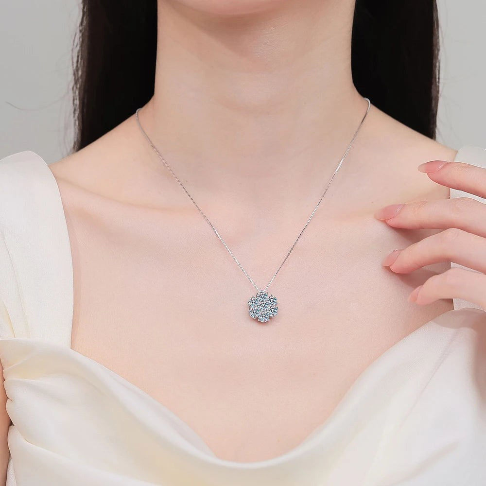 Bee-Bees moissanite solitaire pendant necklace in 925 sterling silver worn on a model with a white dress.