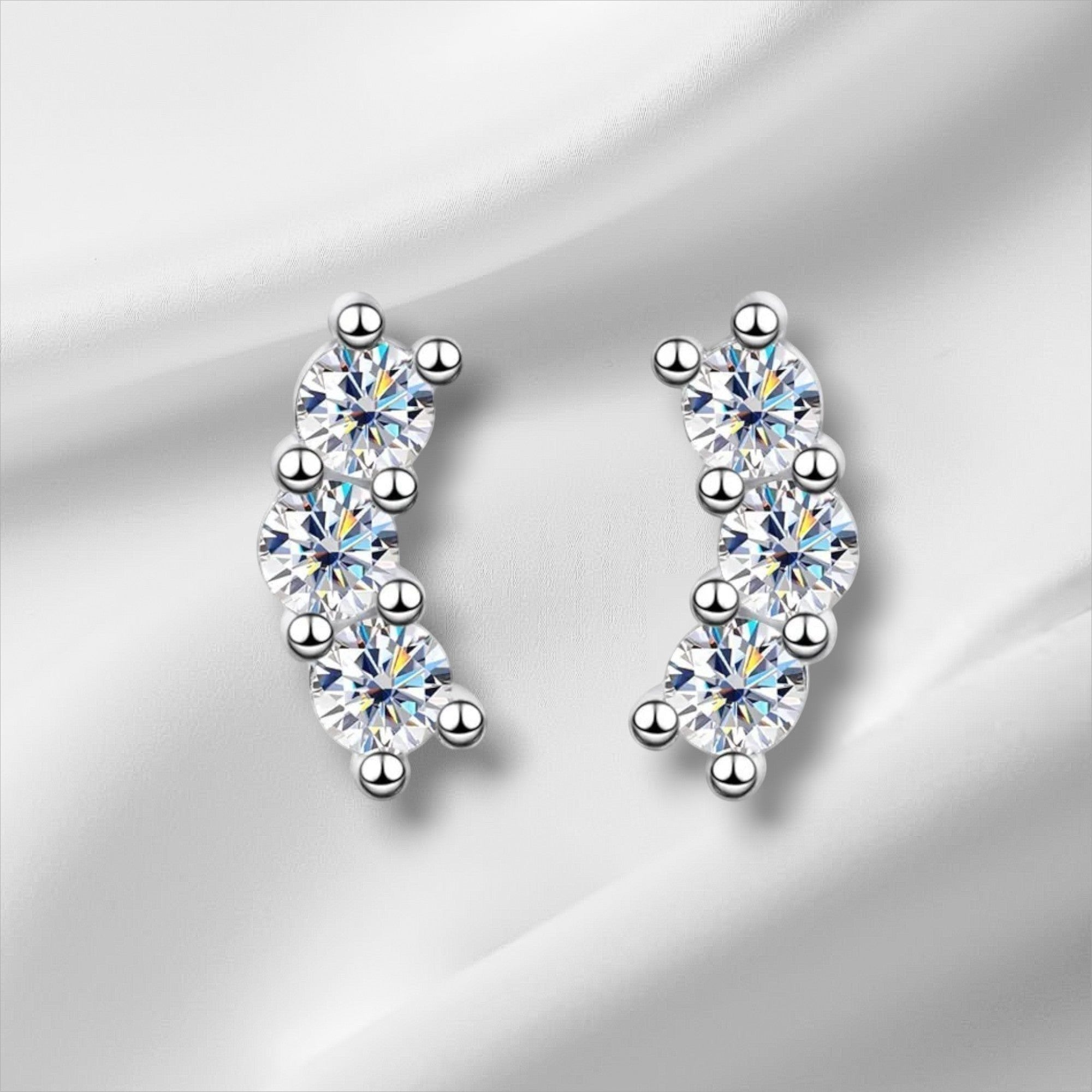 Bee-Bees D Color VVS1 Full Moissanite Studs in 925 Sterling Silver, 4-prong setting, round brilliant cut, white gold plated.