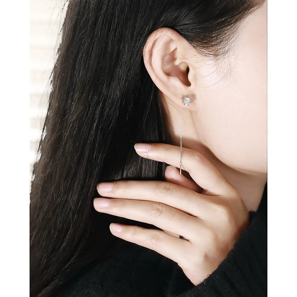 Bee-Bee's sterling silver threader earrings with D VVS moissanite studs and a long chain.
