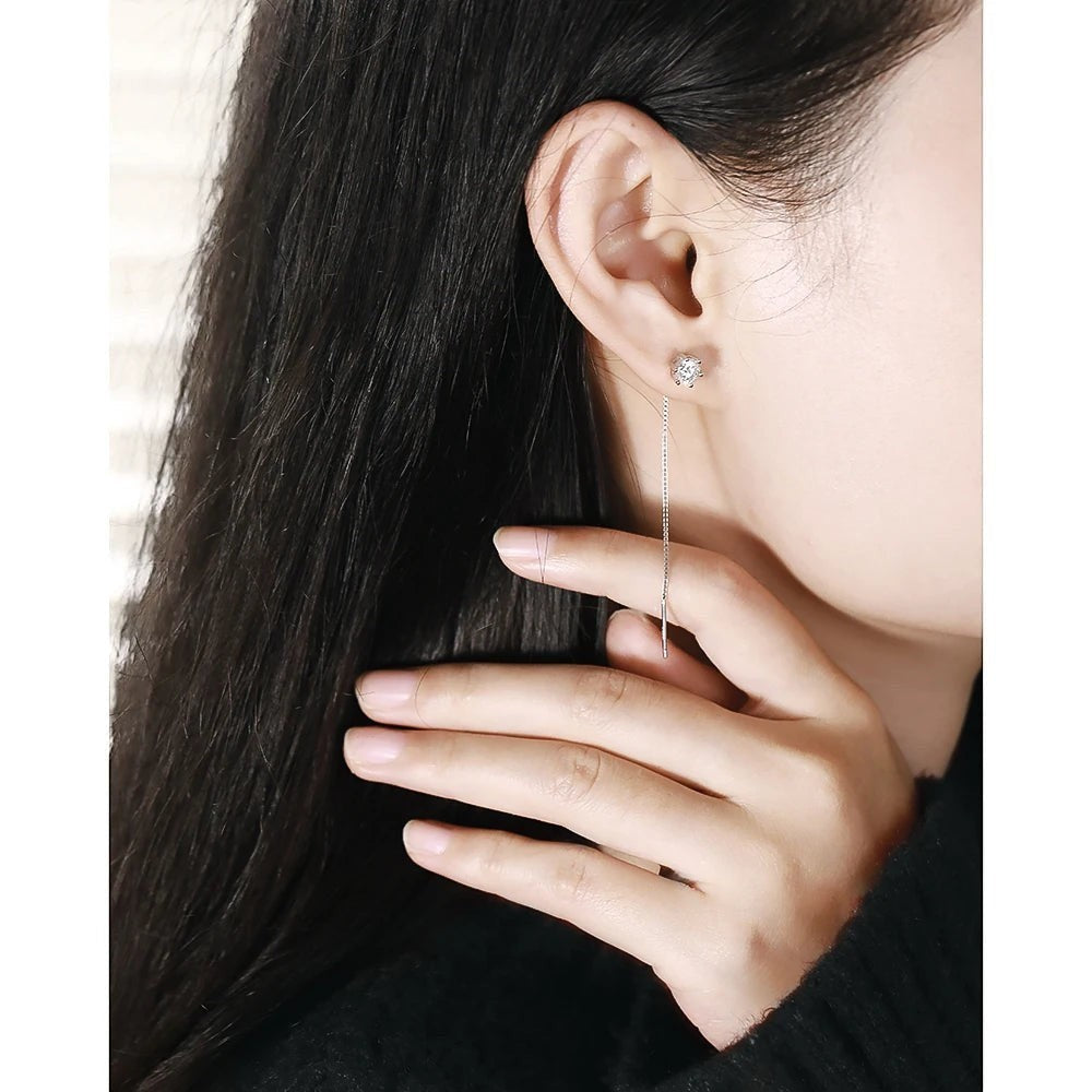 Bee-Bee's sterling silver threader earrings with D VVS moissanite studs and a long chain.