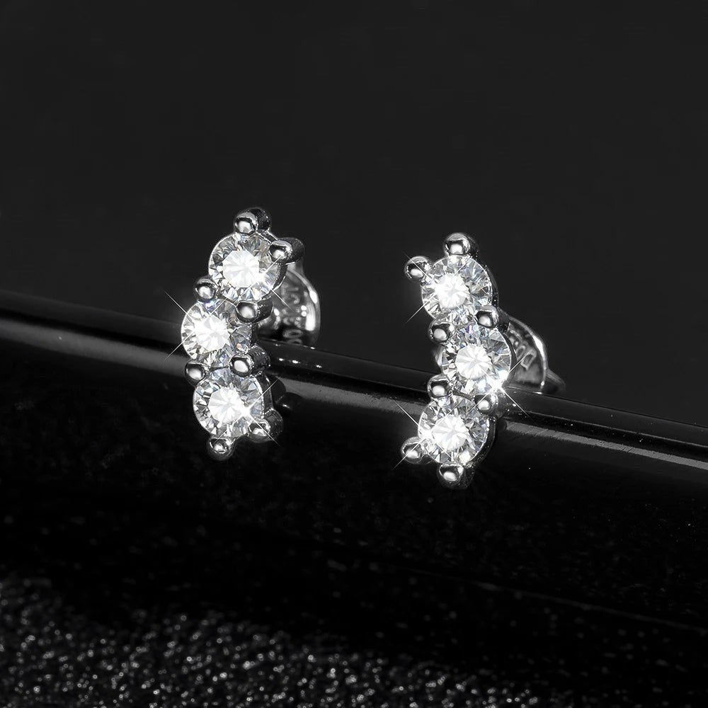 Bee-Bees D Color VVS1 Full Moissanite Studs in 925 Sterling Silver with 18K White Gold plating. Round brilliant cut stones in a 4-prong setting.