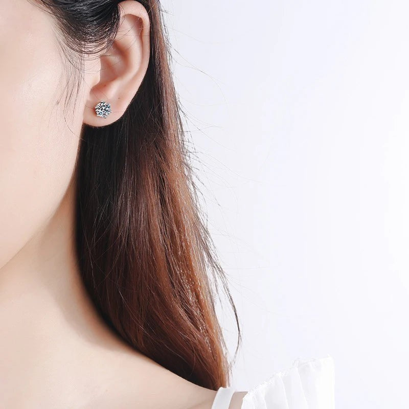 Bee-Bees 6-claw moissanite stud earrings with D color VVS1 clarity in sterling silver with white gold plating.
