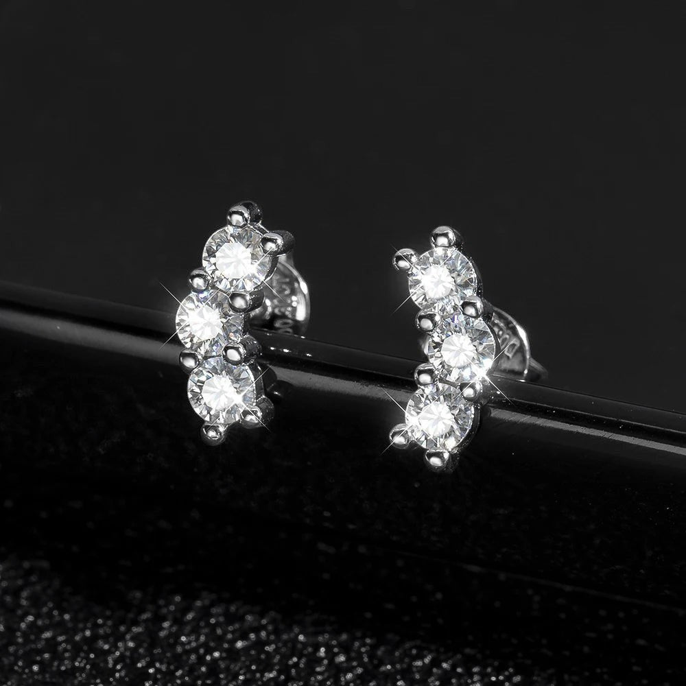 Bee-Bees D Color VVS1 Full Moissanite Studs in 925 Sterling Silver with 18K White Gold plating. Round brilliant cut stones in a 4-prong setting.