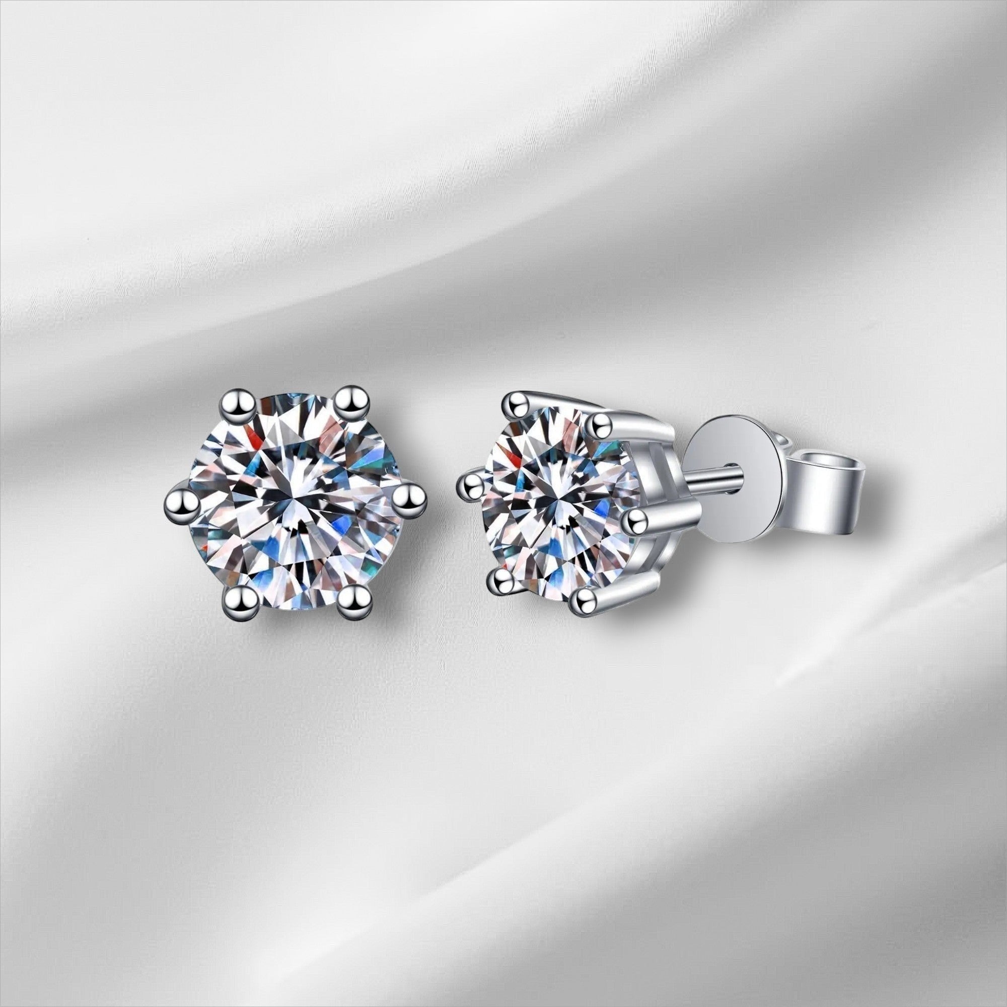 Bee-Bees 6-prong moissanite stud earrings in sterling silver with screw backs, D color, VVS1 clarity.