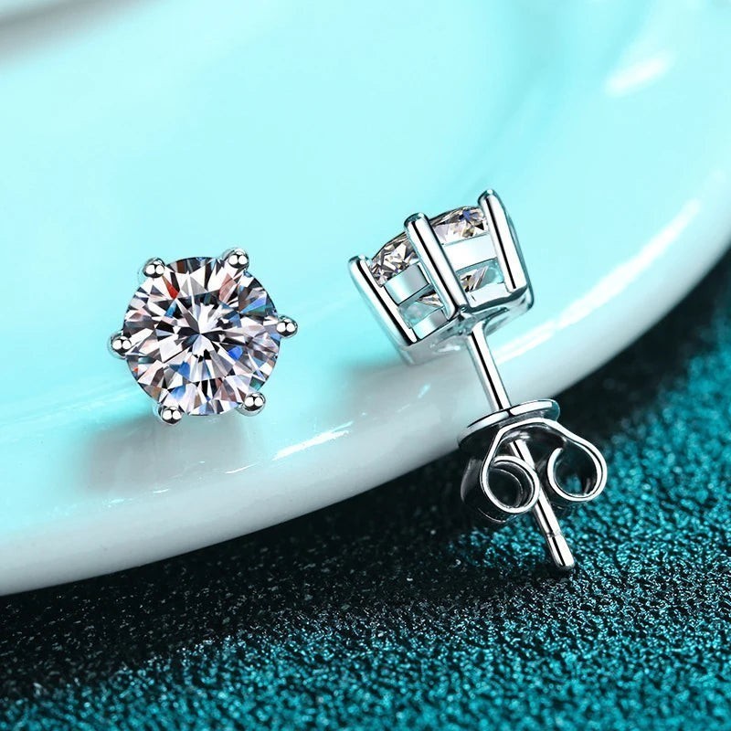 Bee-Bees 6-prong moissanite stud earrings in sterling silver with screw backs. D color, VVS1 clarity.