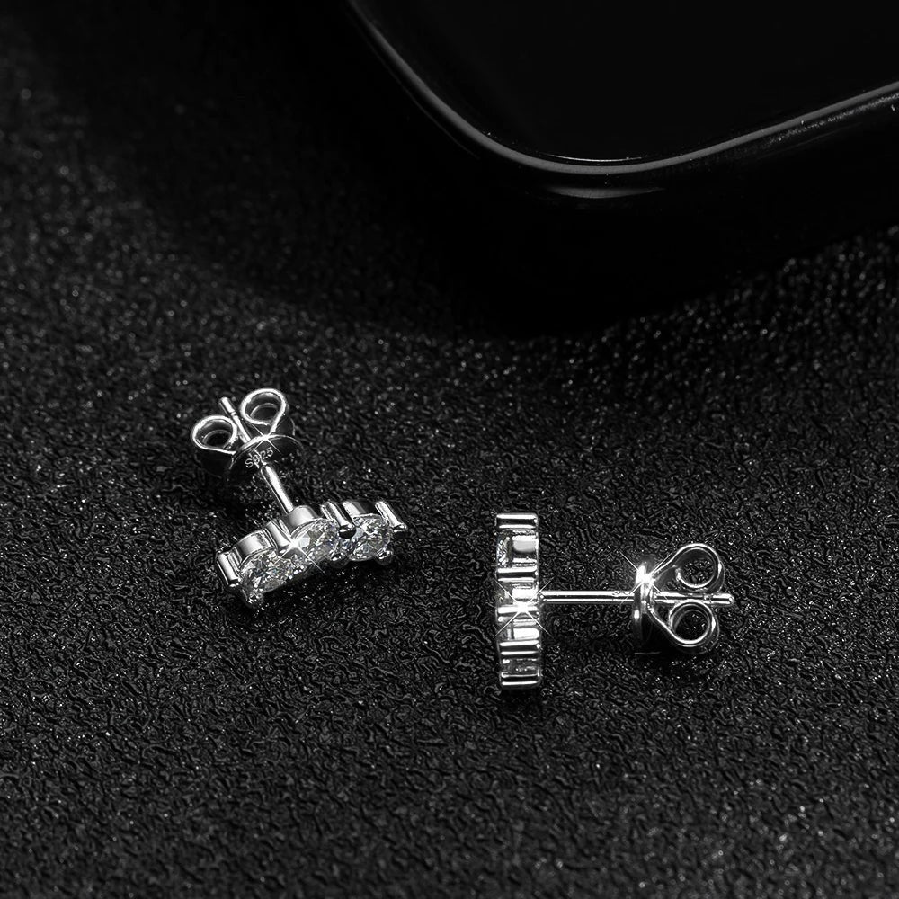 Bee-Bees D Color VVS1 Full Moissanite Studs in 925 Sterling Silver with 18K White Gold plating. Round brilliant cut stones in a 4-prong setting.