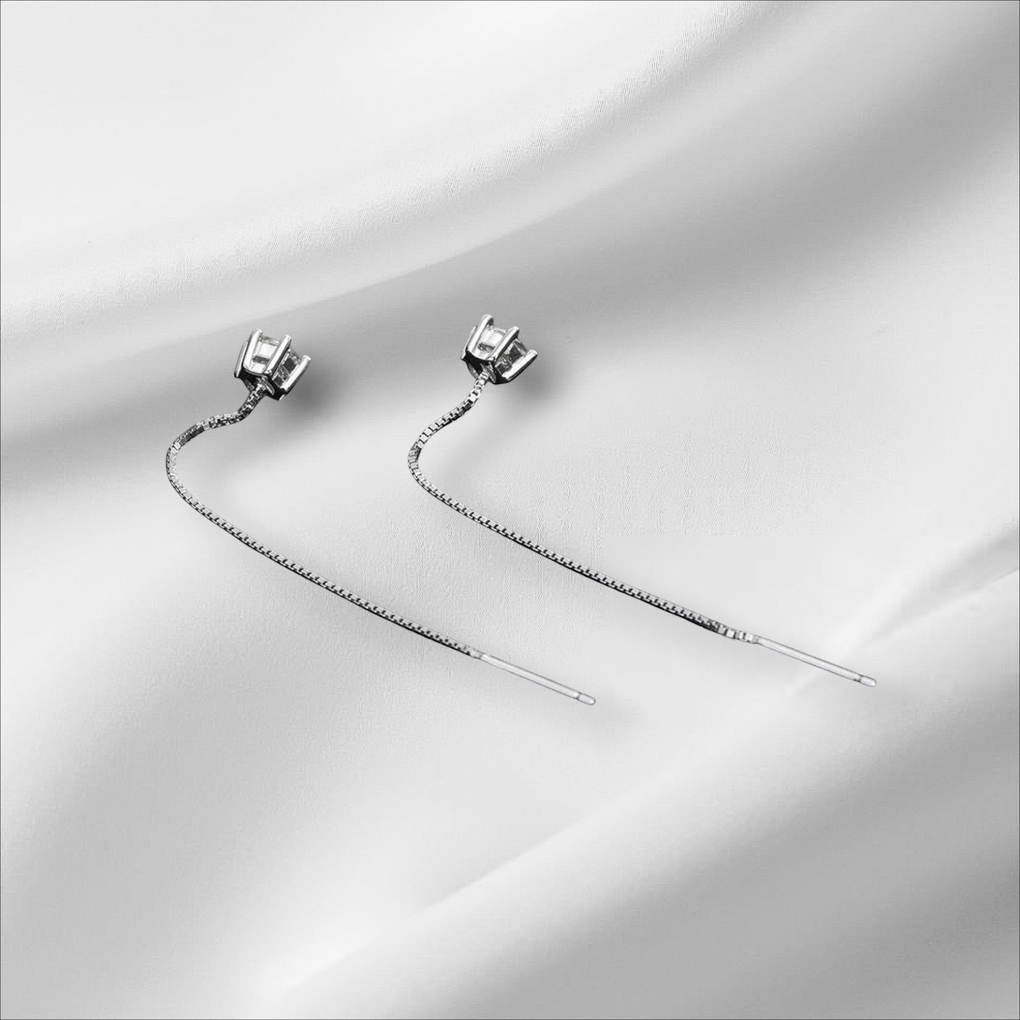 Bee-Bee's D VVS Moissanite stud earrings in S925 sterling silver with 18k white gold plating. Features a classic round cut.