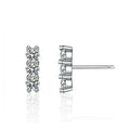 Bee-Bees sterling silver stud earrings with three round D Color VVS1 moissanite stones in a vertical line.