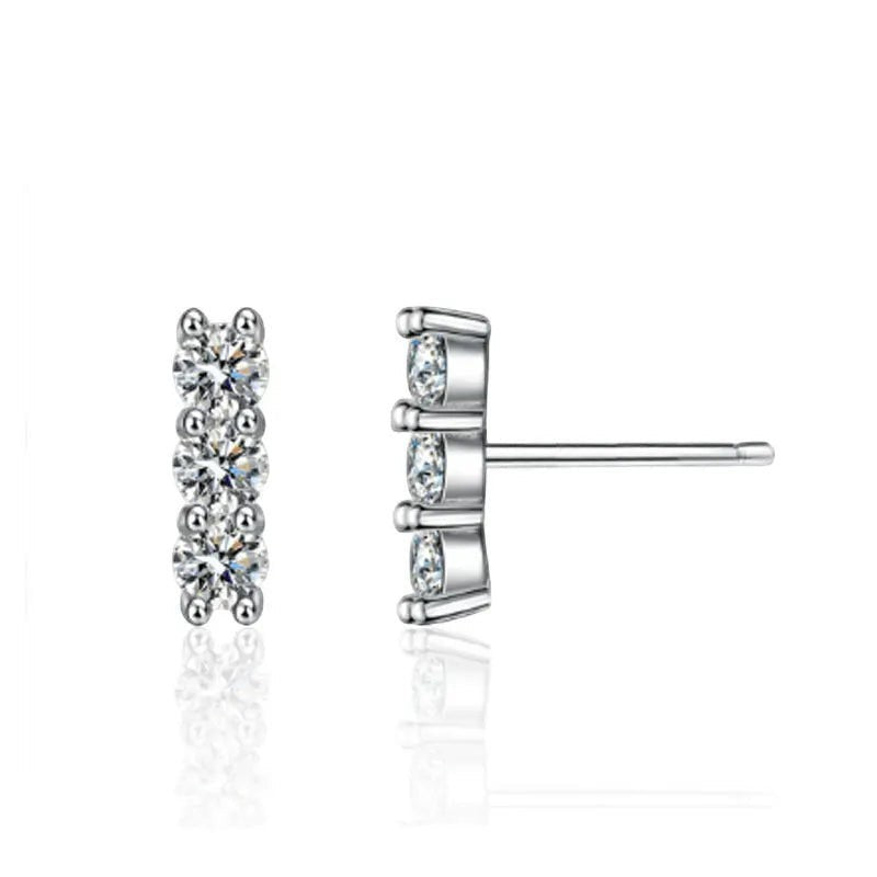 Bee-Bees sterling silver stud earrings with three round D Color VVS1 moissanite stones in a vertical line.