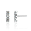Bee-Bees sterling silver stud earrings with three round D Color VVS1 moissanite stones in a vertical line.