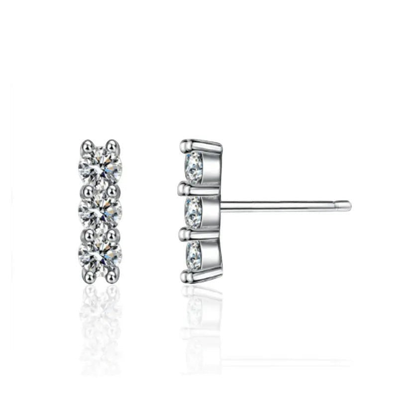Bee-Bees sterling silver stud earrings with three round D Color VVS1 moissanite stones in a vertical line.