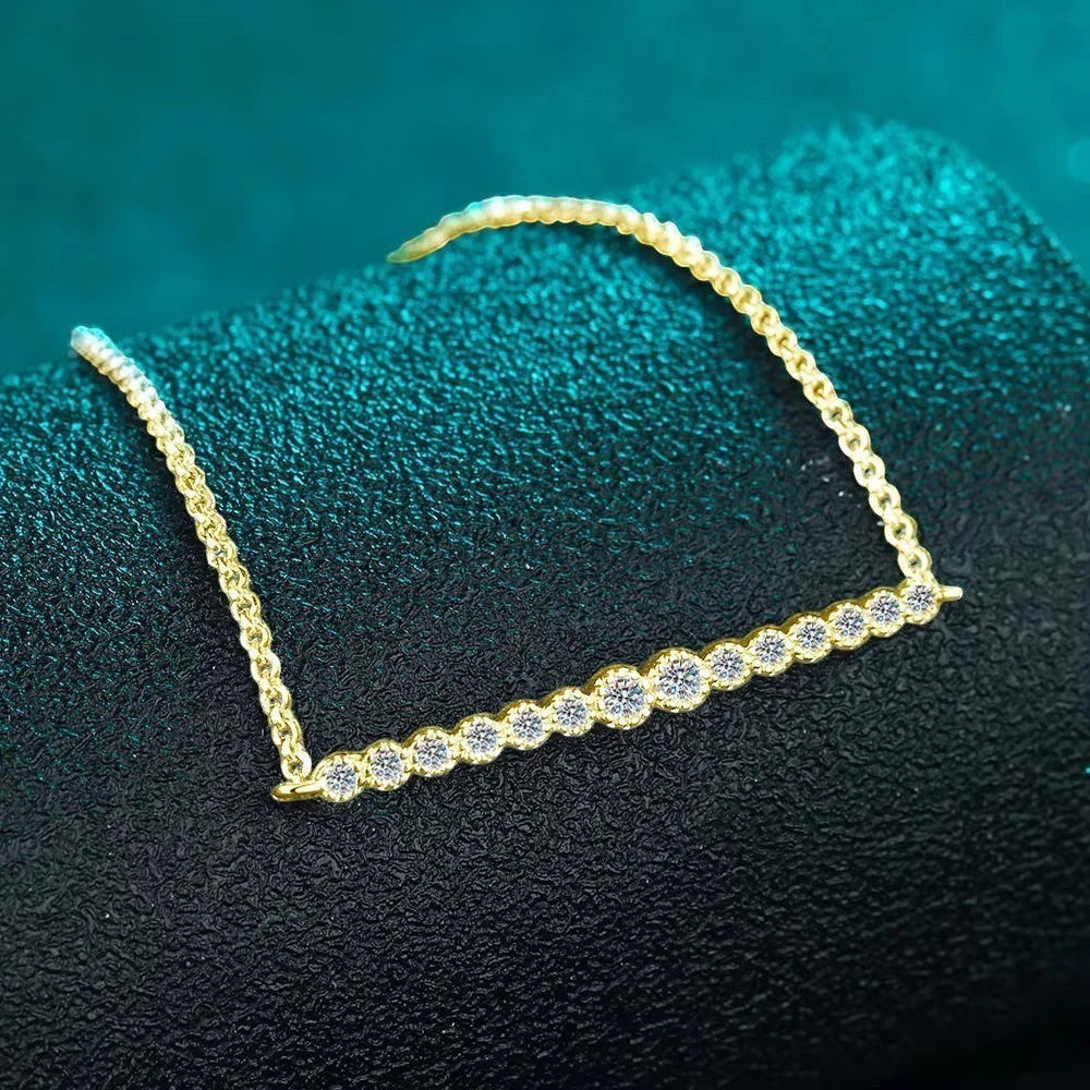 Bee-Bee's dainty gold-plated S925 sterling silver tennis bracelet with D VVS1 Moissanite stones.