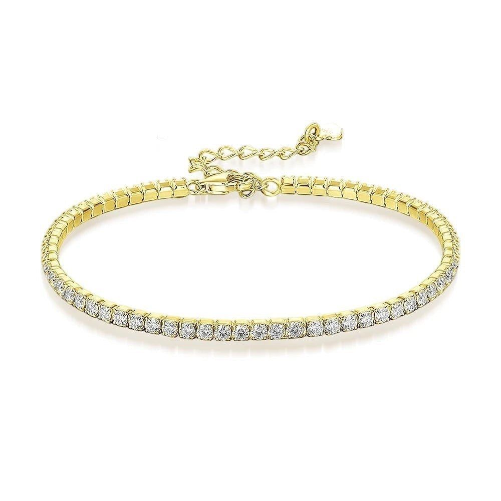 Bee-Bee's 1.5mm gold-plated sterling silver tennis bracelet with VVS1 moissanite stones.