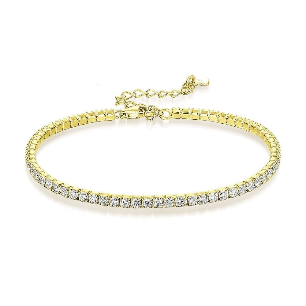 Bee-Bee's 1.5mm gold-plated sterling silver tennis bracelet with VVS1 moissanite stones.