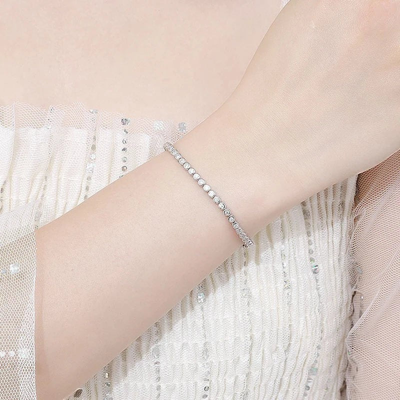 Bee-Bees 2mm D Color VVS1 Moissanite tennis bracelet in S925 silver with white gold plating.