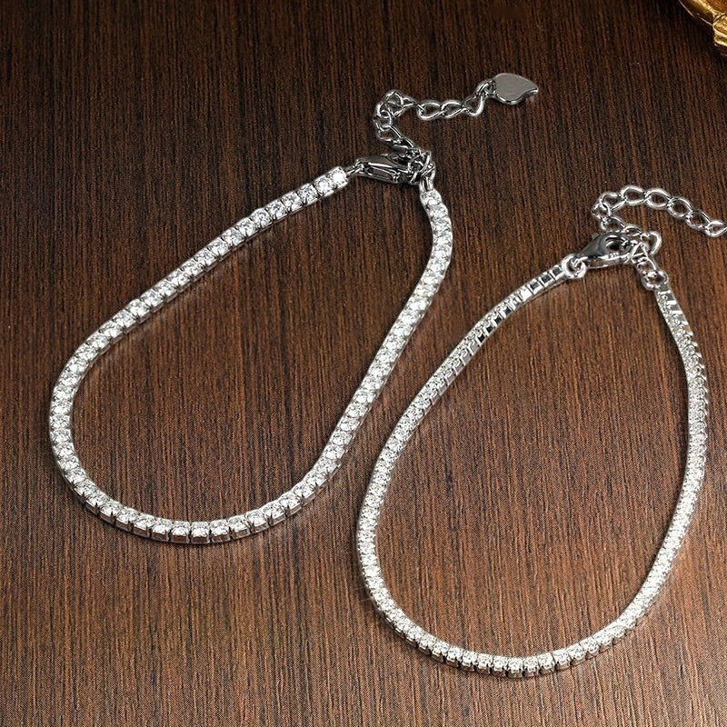 Bee-Bee's 1.5mm or 2mm Moissanite tennis bracelet in sterling silver with gold plating. D VVS1 stones.