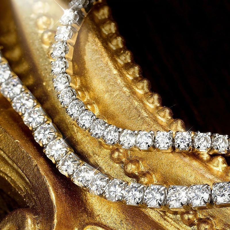 Bee-Bee's 1.5mm or 2mm Moissanite tennis bracelet in sterling silver with gold plating. D VVS1 stones.