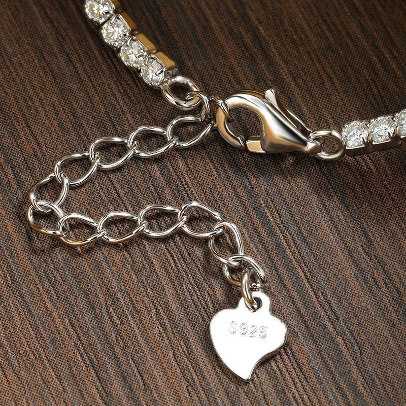 Bee-Bees sterling silver tennis bracelet with 1.5mm or 2mm moissanite stones and adjustable clasp.