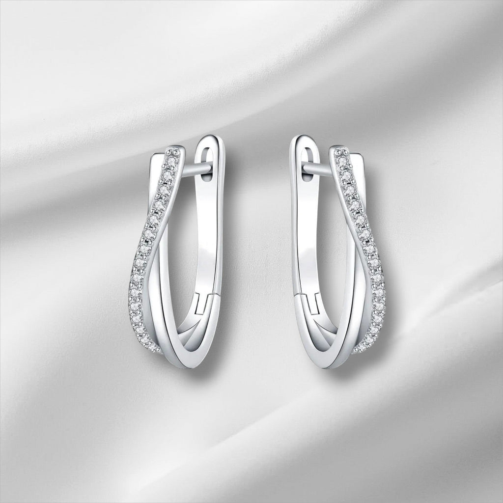 Bee-Bee's sterling silver twisted hoop earrings with pavé-set D Color VVS1 moissanite stones.