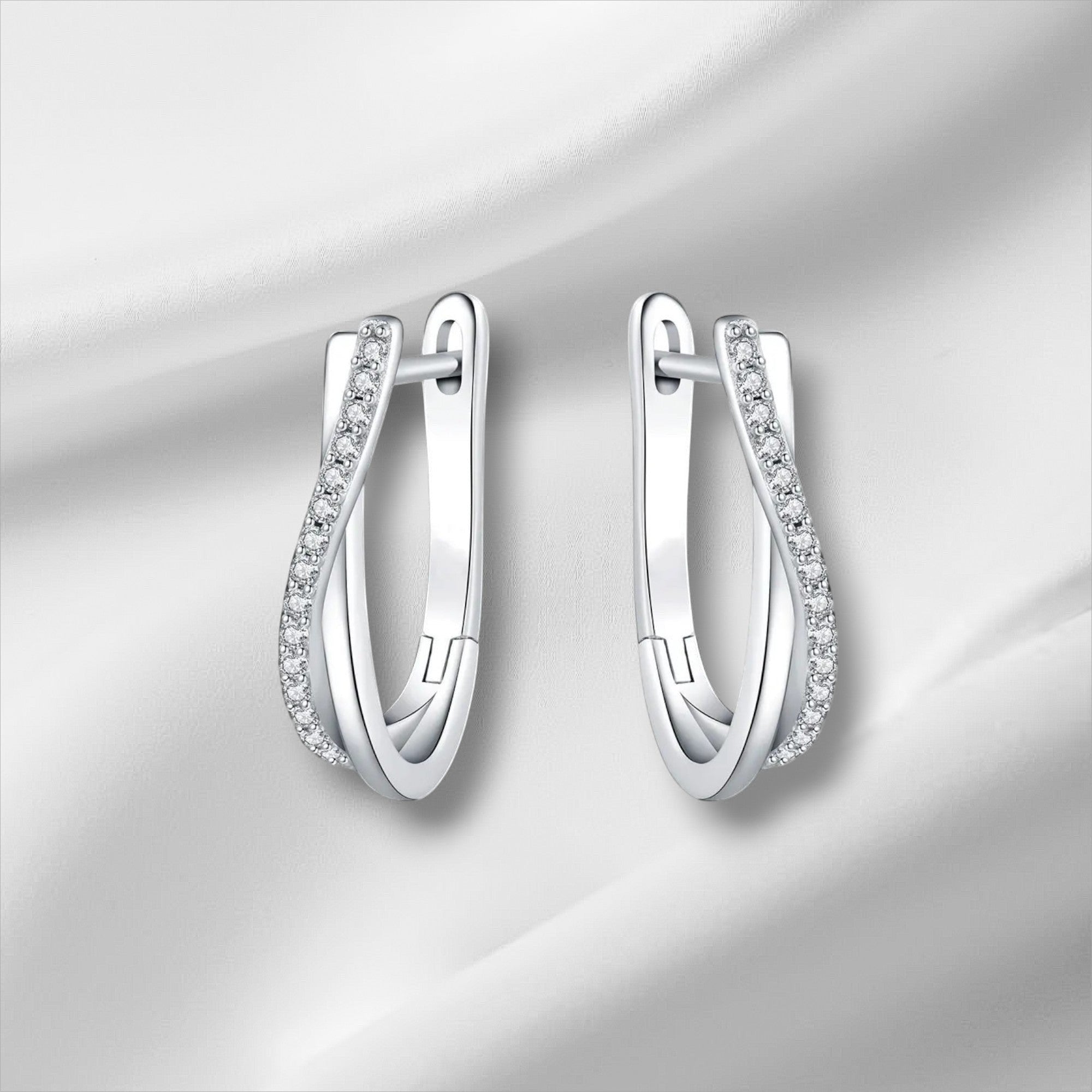 Bee-Bee's sterling silver twisted hoop earrings with pavé-set D Color VVS1 moissanite stones.