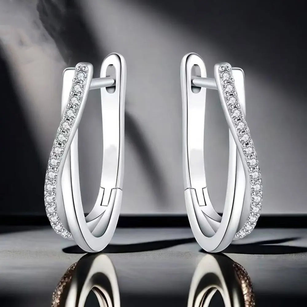 Bee-Bee's sterling silver twisted hoop earrings with pavé-set D Color VVS1 moissanite stones.