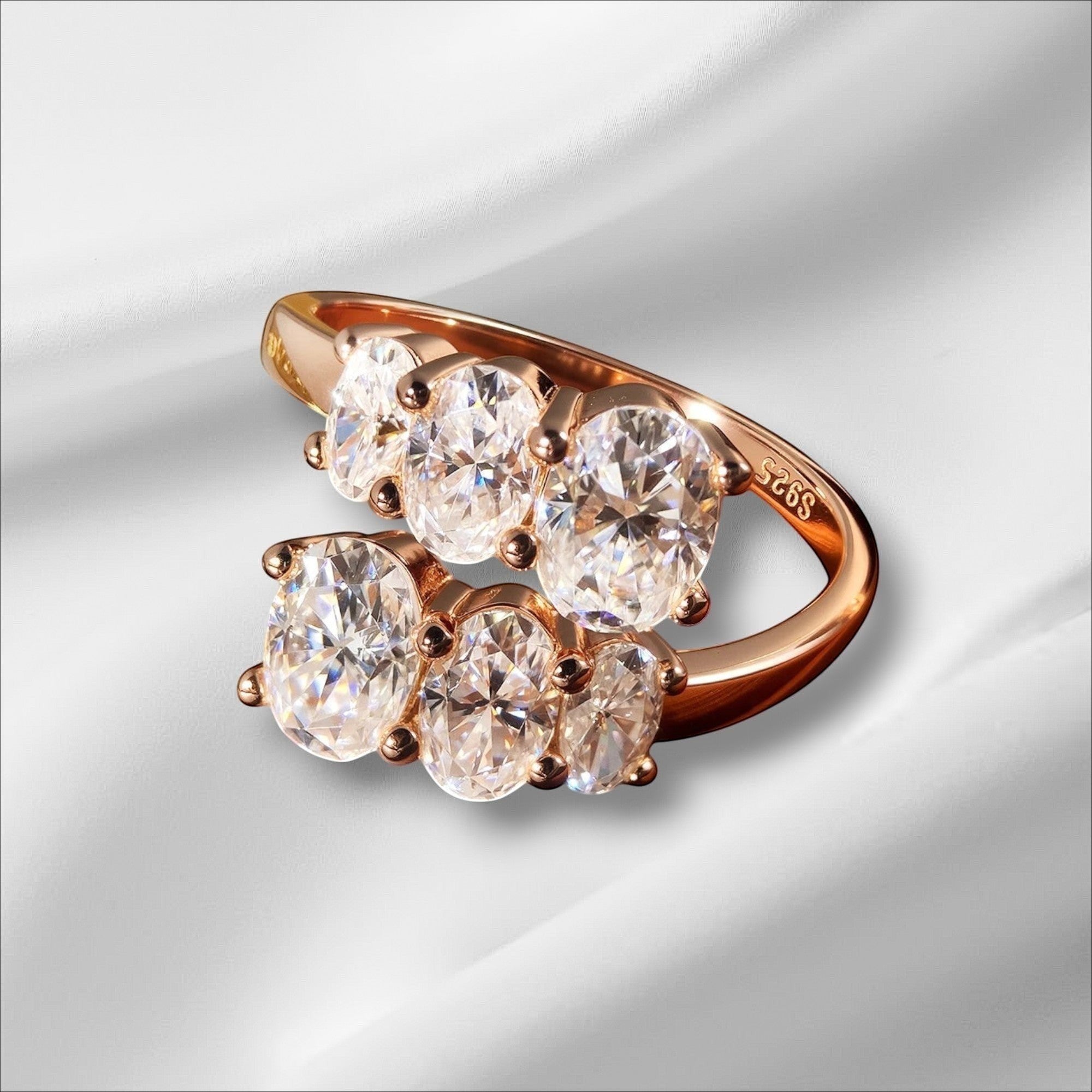 Bee-Bees rose gold sterling silver engagement ring with 3.6CT oval moissanite stones in prong setting.