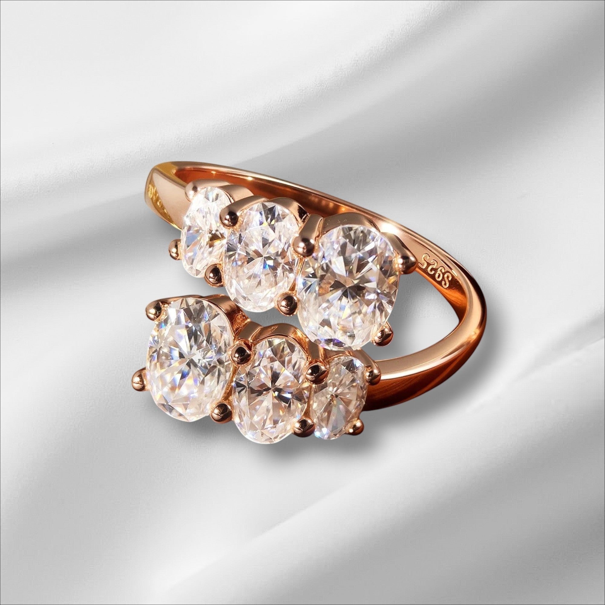 Bee-Bees rose gold sterling silver engagement ring with 3.6CT oval moissanite stones in prong setting.