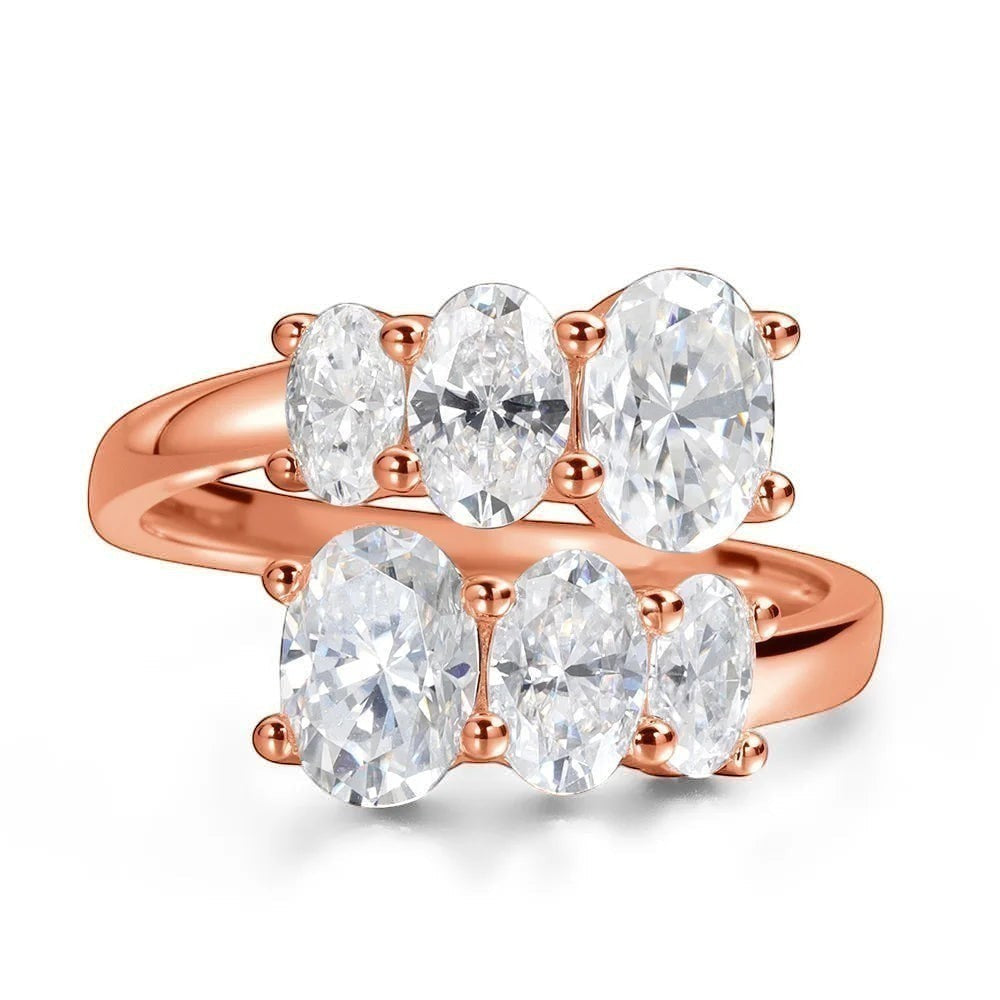 Bee-Bees 3.6CT oval moissanite engagement ring in rose gold sterling silver with five oval cut stones.