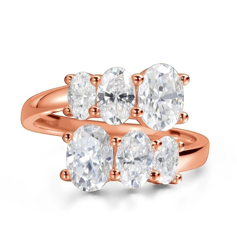 Bee-Bees 3.6CT oval moissanite engagement ring in rose gold sterling silver with five oval cut stones.