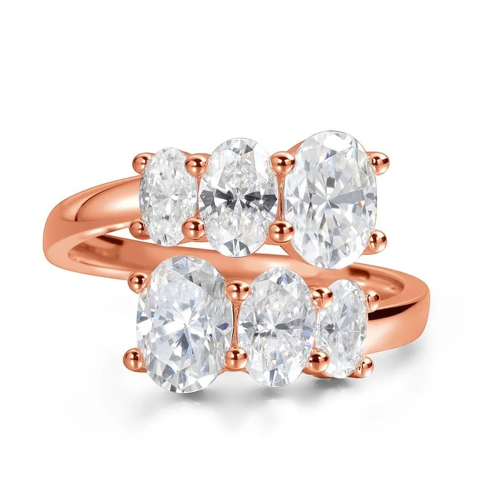 Bee-Bees 3.6CT oval moissanite engagement ring in rose gold sterling silver with five oval cut stones.