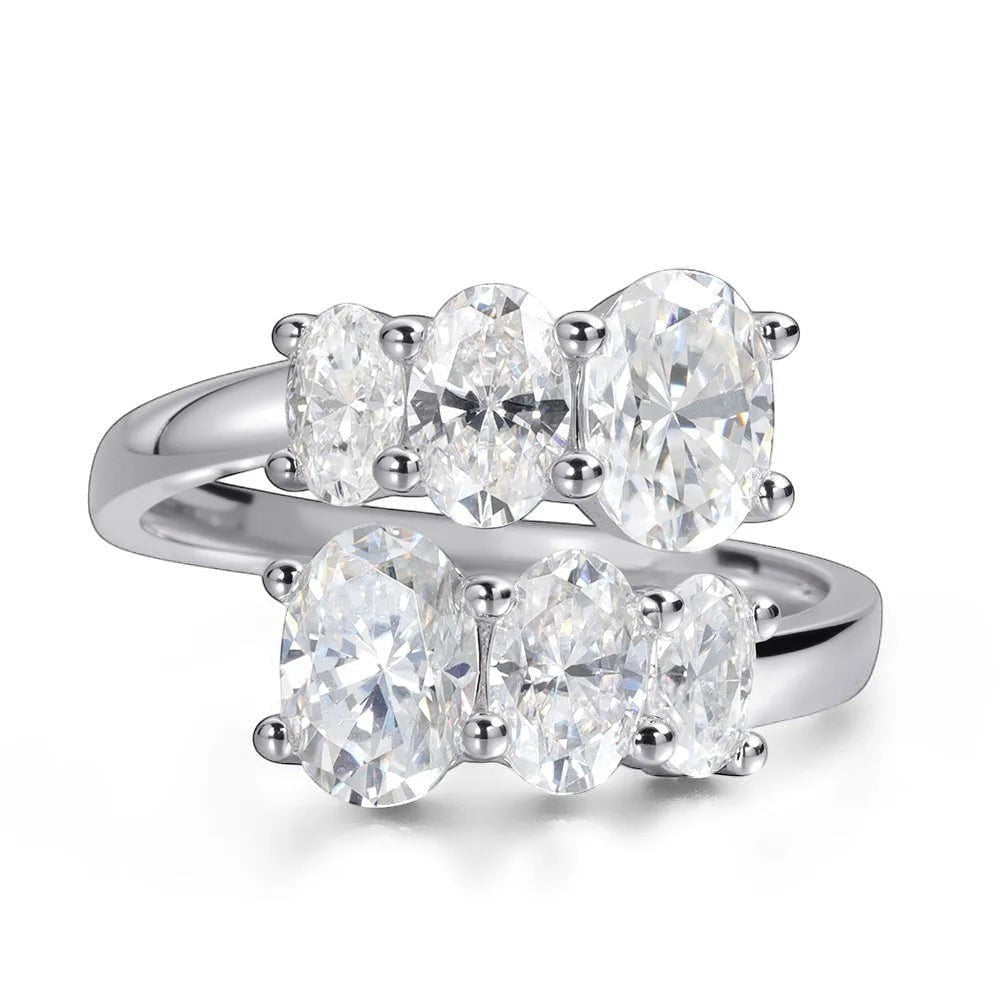 Bee-Bees 3.6CT oval moissanite engagement ring in S925 sterling silver with 18K white gold plating. Features five oval-cut stones.