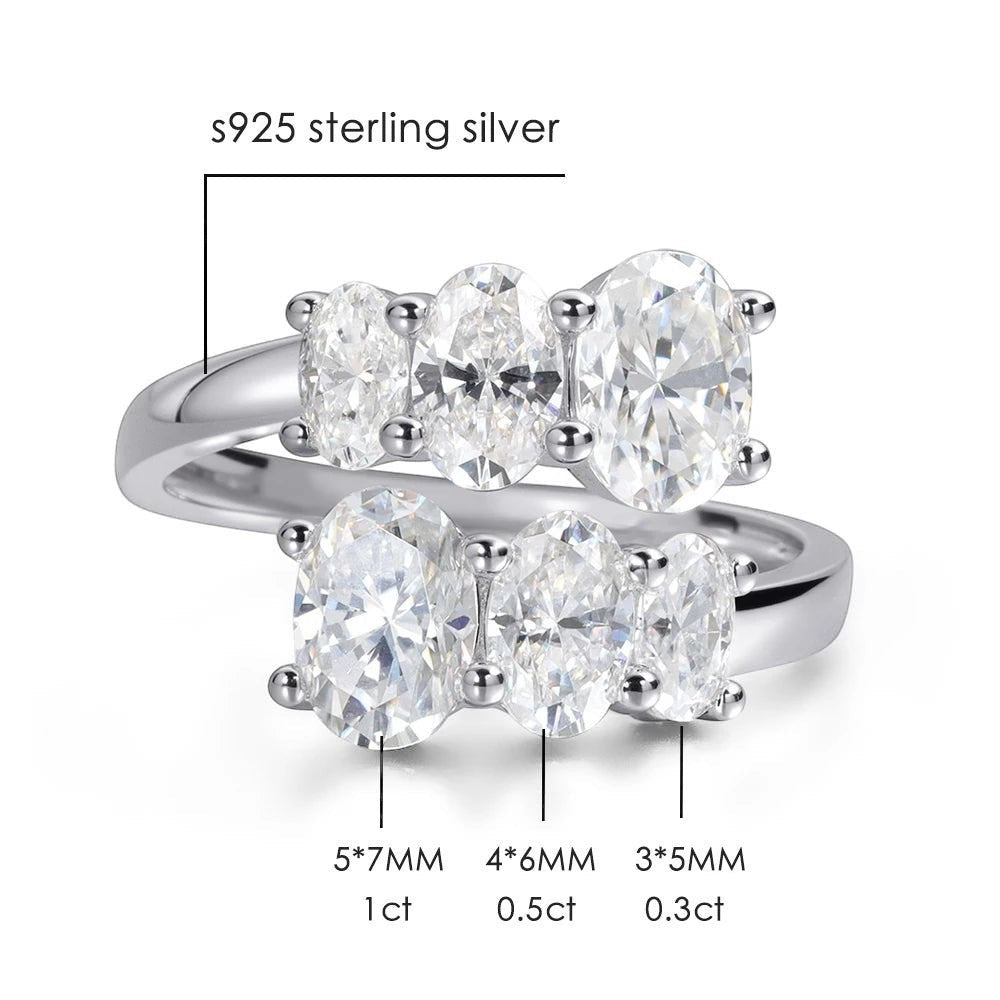 Bee-Bees sterling silver engagement ring with five oval-cut moissanite stones in a bypass setting. Features 18K white gold plating.