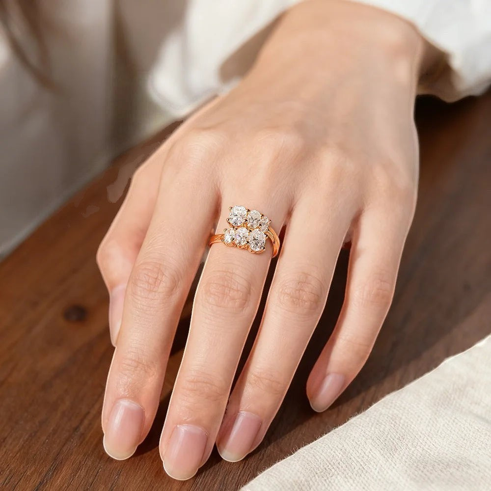 Bee-Bees 3.6CT oval moissanite engagement ring in 18K white gold plated sterling silver with a cluster of round stones.