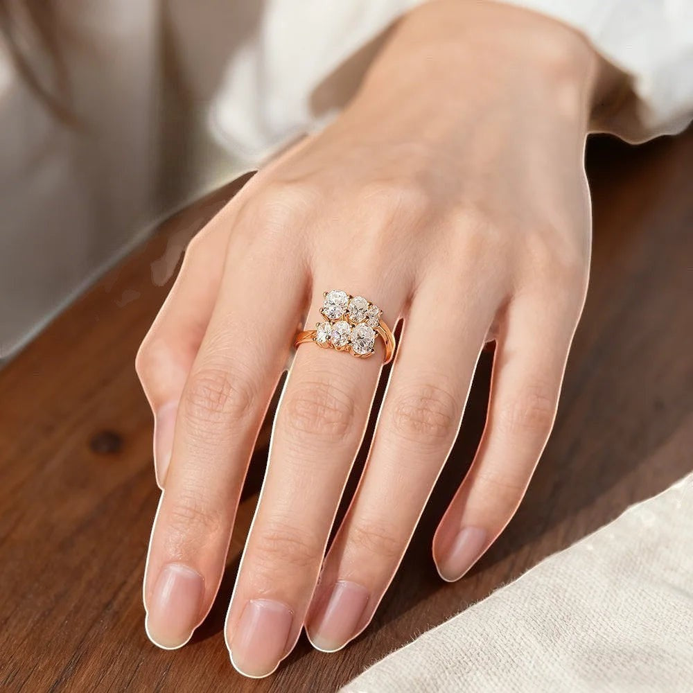 Bee-Bees 3.6CT oval moissanite engagement ring in 18K white gold plated sterling silver with a cluster of round stones.