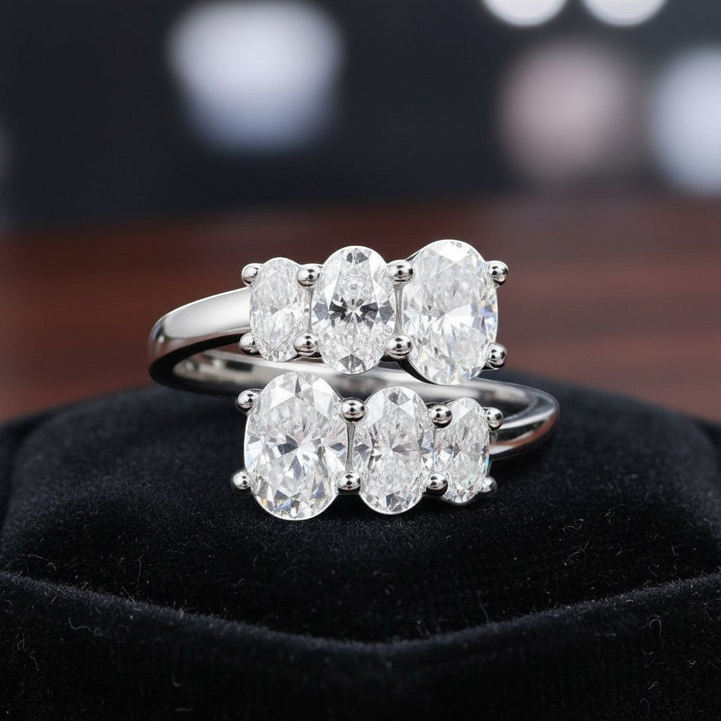 Bee-Bee's 3.6CT oval moissanite engagement ring in sterling silver with 18K white gold plating. Features five oval cut stones.