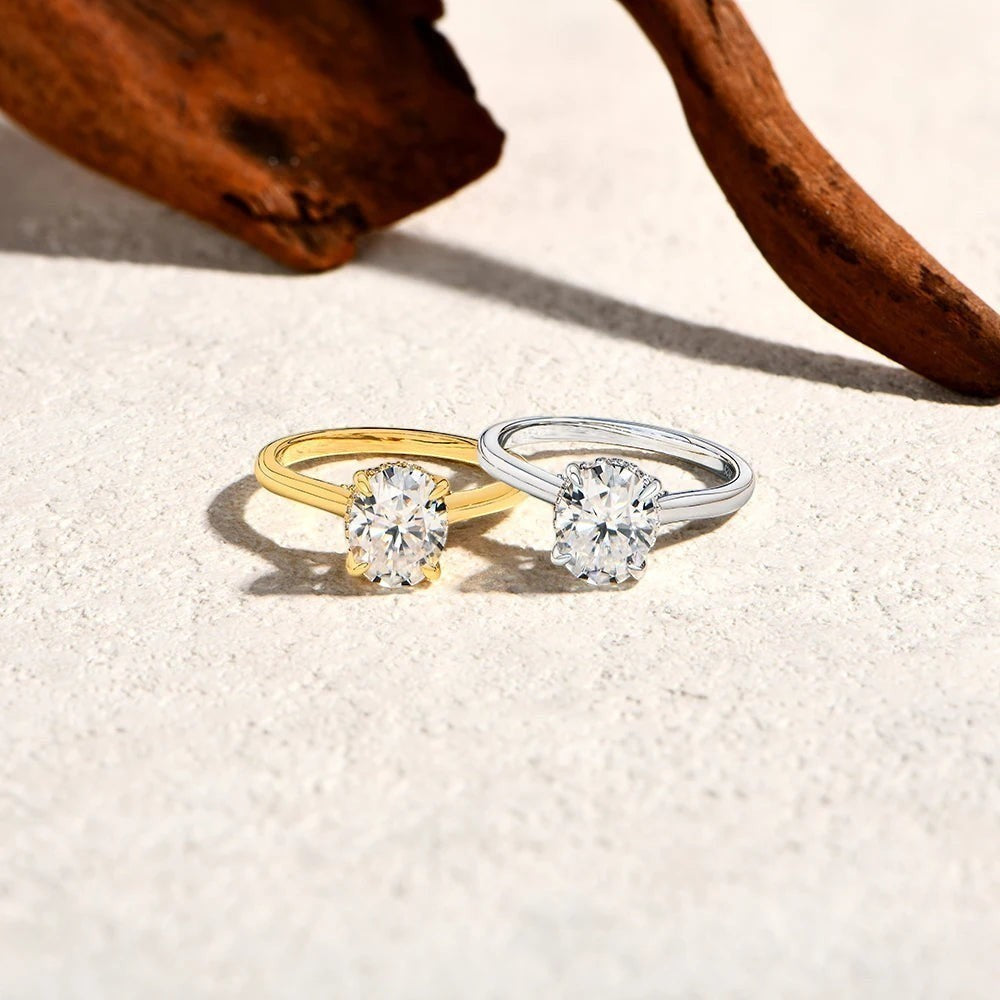 Bee-Bees 2CT oval moissanite engagement rings in sterling silver and gold with classic four-prong settings.