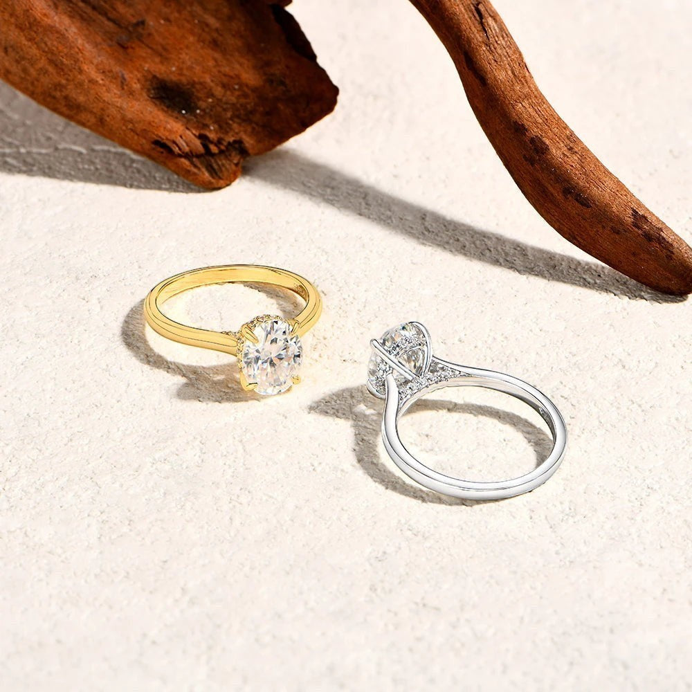 Bee-Bees 2CT oval moissanite engagement rings in gold and sterling silver with classic four-prong settings.